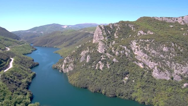 Aerial view of Aliakmonas river in valley , Veria Greece, motion in front of a drone