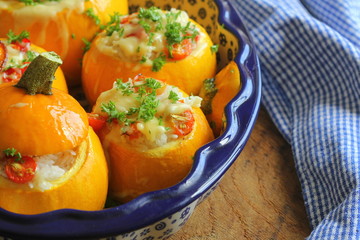 Round zucchini stuffed with rice and mozzarella