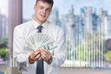 Young businessman enjoys financial success .