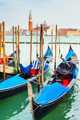 Gondolas on the Grand canal near San Marco square in Venice, Italy. San Giorgio Maggiore Cathedral in the background
