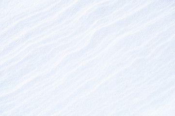 Snow cover in a field after blizzard. Abstract winter background.