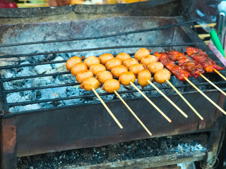 Grilled small sausages on skewers