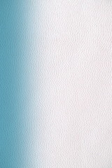  The texture of genuine leather.  Blue skin texture closeup. Colorful background with gradient.
