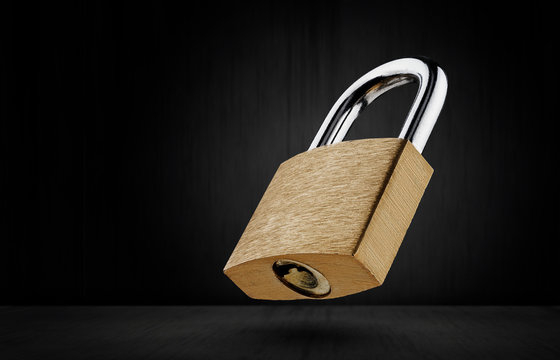 Lock on a dark background. Safety concept. Free space for advertising.