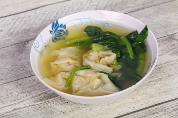 Asian traditional Wonton soup with herbs