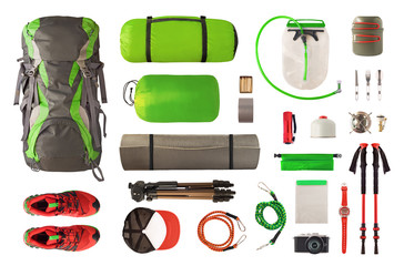 Top view of sport equipment and gear for trekking and camping. Collection of cookware, sleeping...