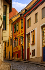 Fototapeta na wymiar Narrow street with colorful old town houses