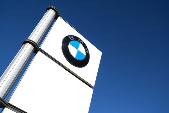 WIEHL, GERMANY - April 20, 2018: BMW dealership sign against blue sky. BMW is one of the best-selling luxury automakers in the world.