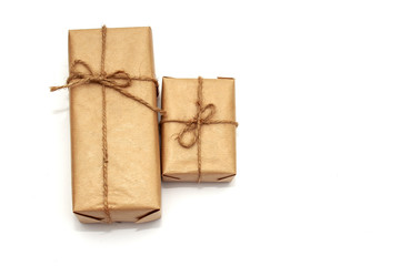 Two gift boxes in craft paper isolated on white background
