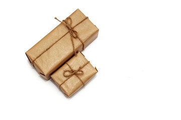 Two gift boxes in craft paper isolated on white background