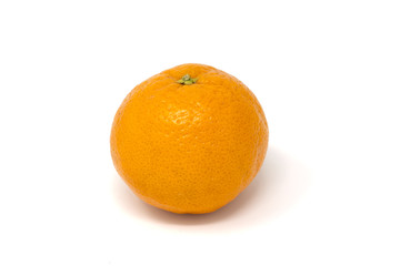 an orange fruit on a white background