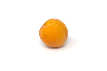 an apricot fruit on a white background