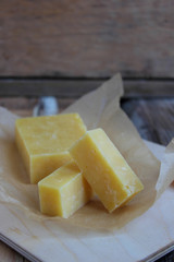 Raw cheese platter on rustic background,top view
