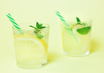 Lemonade or mojito cocktail with lemon and mint