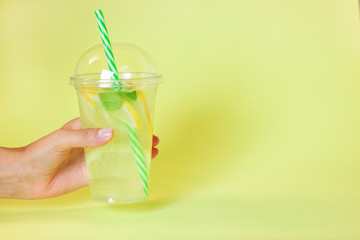 Lemonade or mojito cocktail with lemon and mint