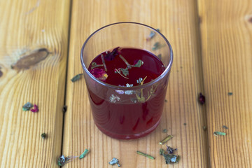 Red hibiscus tea in a glass cup
