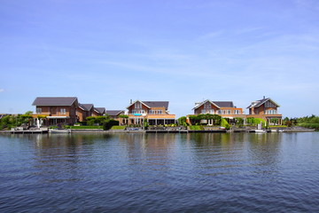 Fototapeta na wymiar Dutch houses on the waterside in the city of Almere. 