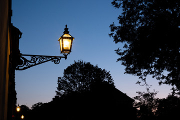 Old lamp in evening sky