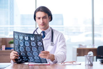Young male doctor radiologist working in the clinic