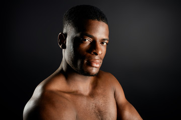 Fototapeta premium good looking American man with strict expression looking at the camera. close up portrait. studio shot. copy space