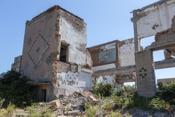 Ruined house. Remains of old houses. Apocalypse. Abandoned city. City of ghosts. Ruins of old historic houses destroyed by an earthquake and devastating operation of urban structures. Broken building
