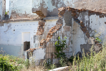 Ruined house. Remains of old houses. Apocalypse. Abandoned city. City of ghosts. Ruins of old...