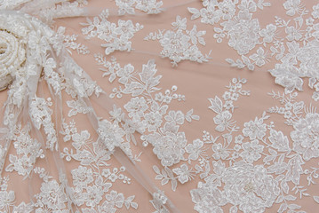 Texture lace fabric. lace on white background studio. thin fabric made of yarn or thread. a...