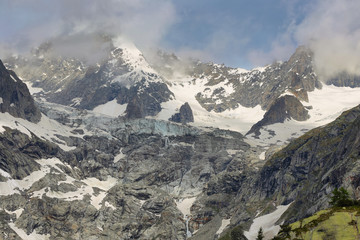 Fototapeta na wymiar View of mountain peaks with glaciers in Val Ferret, Aosta valley, Italy