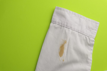 Dirty shirt on color background