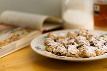 plate of christmas cookies with book in the background