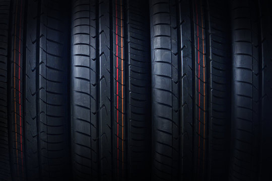 New tires background. Photo was taken close to the tire texture. Beautiful tyres pattern for your design.