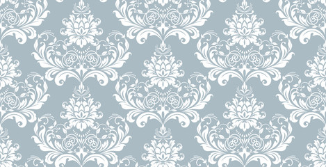 Floral pattern. Vintage wallpaper in the Baroque style. Seamless vector background. White and blue ornament for fabric, wallpaper, packaging. Ornate Damask flower ornament