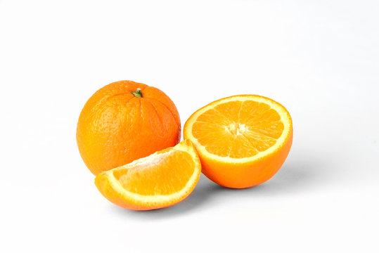 Orange fruit with slice isolated on white background.