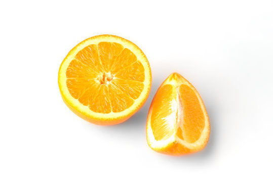 Orange fruit with slice isolated on white background.