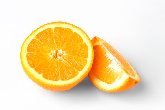 Orange fruit with slice isolated on white background.