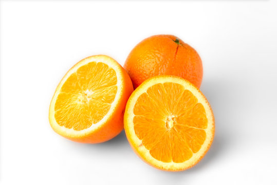Orange fruit with slice isolated on white background.