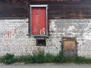 Wall with old doors in a yard in Russia