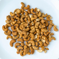 Fototapeta na wymiar close - up cashews nut in bowl on white background