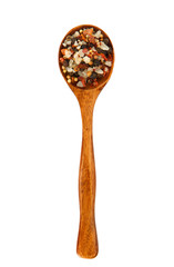 Mix seasonings in a wooden spoon on isolate. Spice in the spoon. View from above. Seasonings on isolate.