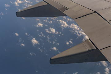 View of the earth from the wing of the aircraft.	