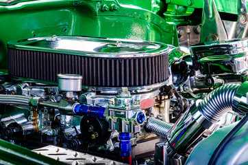 Close-up right side view of a hot rod engine with two carburetors