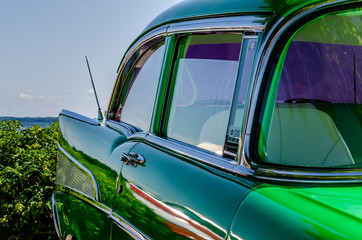 Quarter right view of a green vintage car