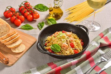 Traditional Italian pasta on black rustic pan