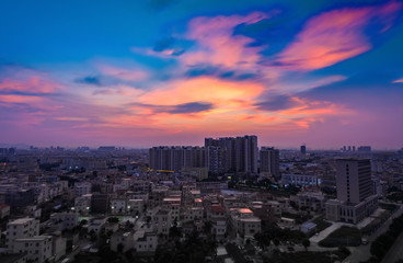 residential area in a chinese suburb in the evening with beautiful red and gold clouds