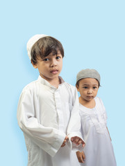 Muslim boy in a dress , isolate background