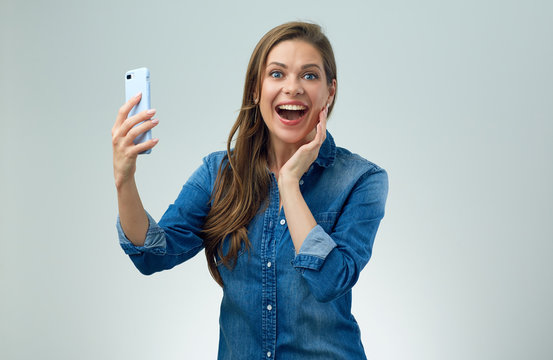 Happy woman doing selfie with smart phone.