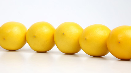whole lemons together on white background