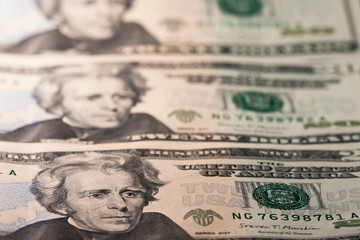 Twenty dollar bill. 20 dollar bill. Image isolated on black background. Banknotes placed in order,...