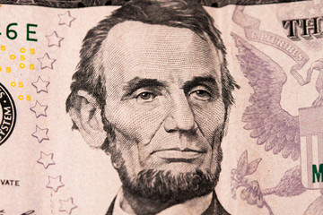 Five dollar bill. Five dollar bill. Banknotes placed in order, the face of President Lincoln of the United States.
