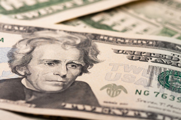 Dollar bills as background close-up. 20 dollar bills located in front and behind. US Currency.
